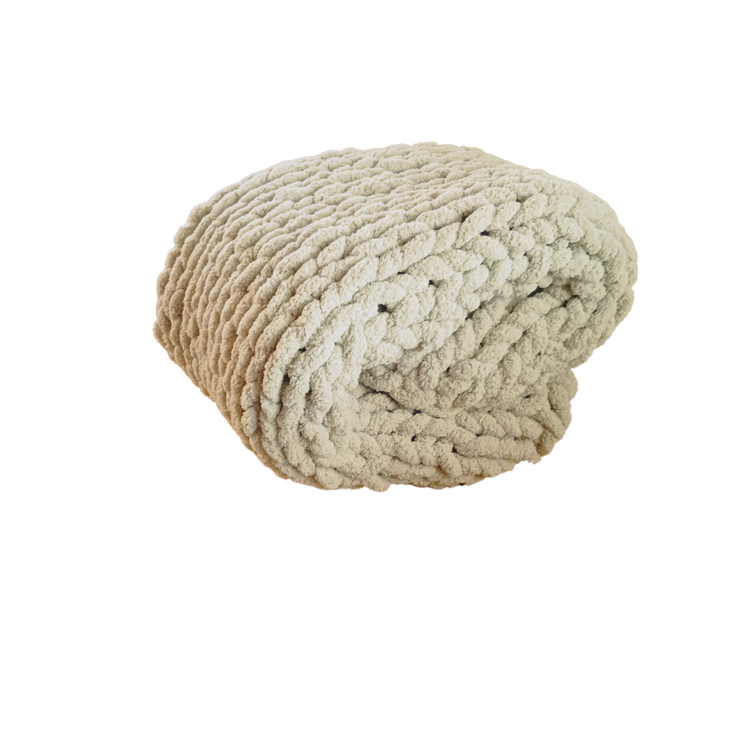 Folded Taupe chunky knit blanket.