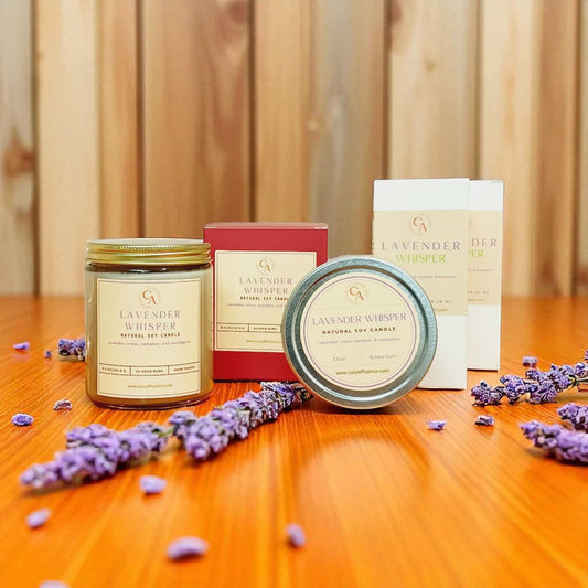 Candles and packaging with lavender on a wooden surface