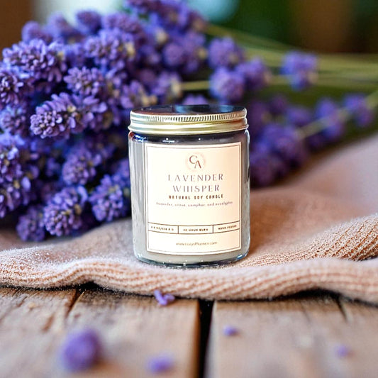 Natural Soy Candle labeled 'Lavender Whisper' with lavender flowers on a wooden surface.