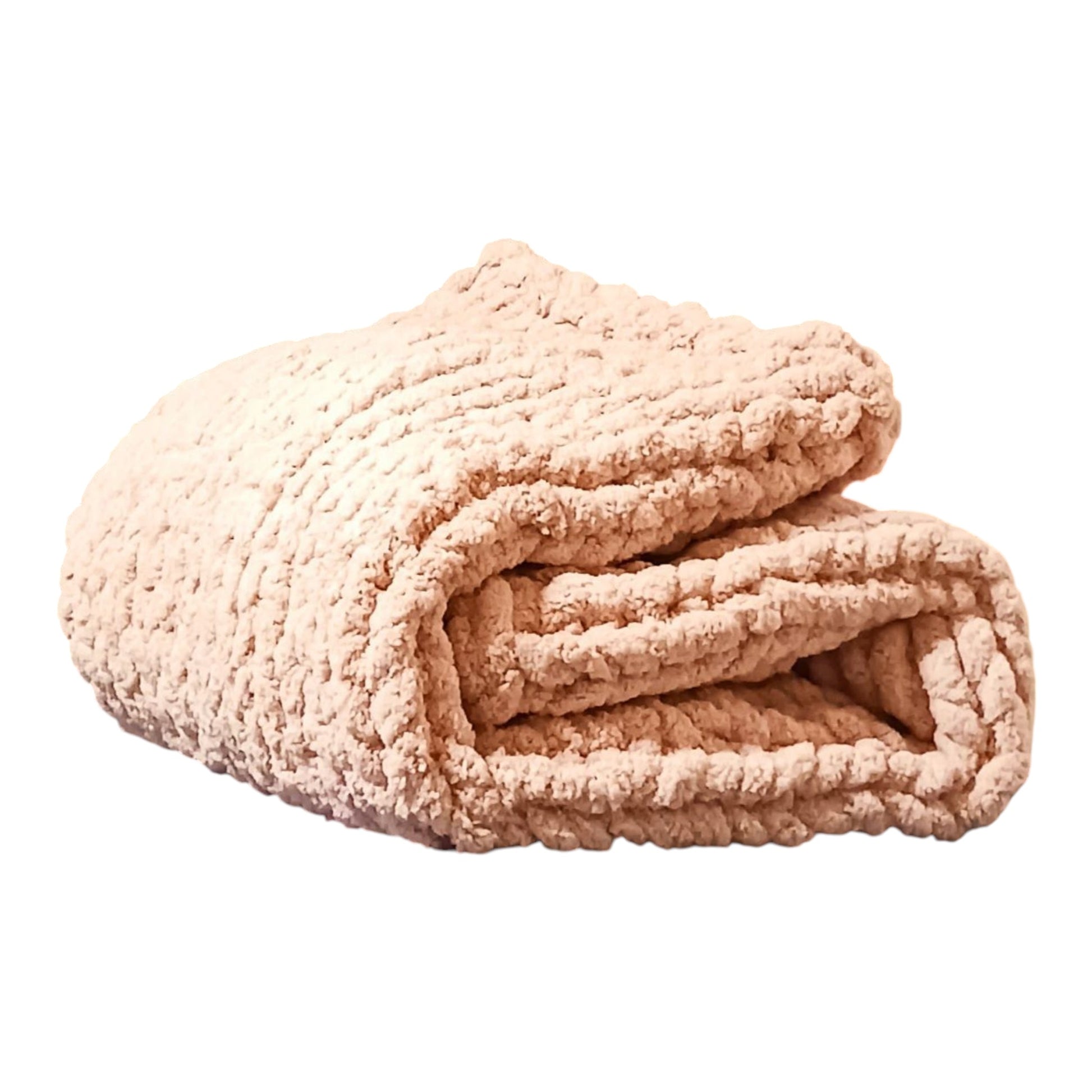 Folded champagne blush chunky knit blanket on a white background.