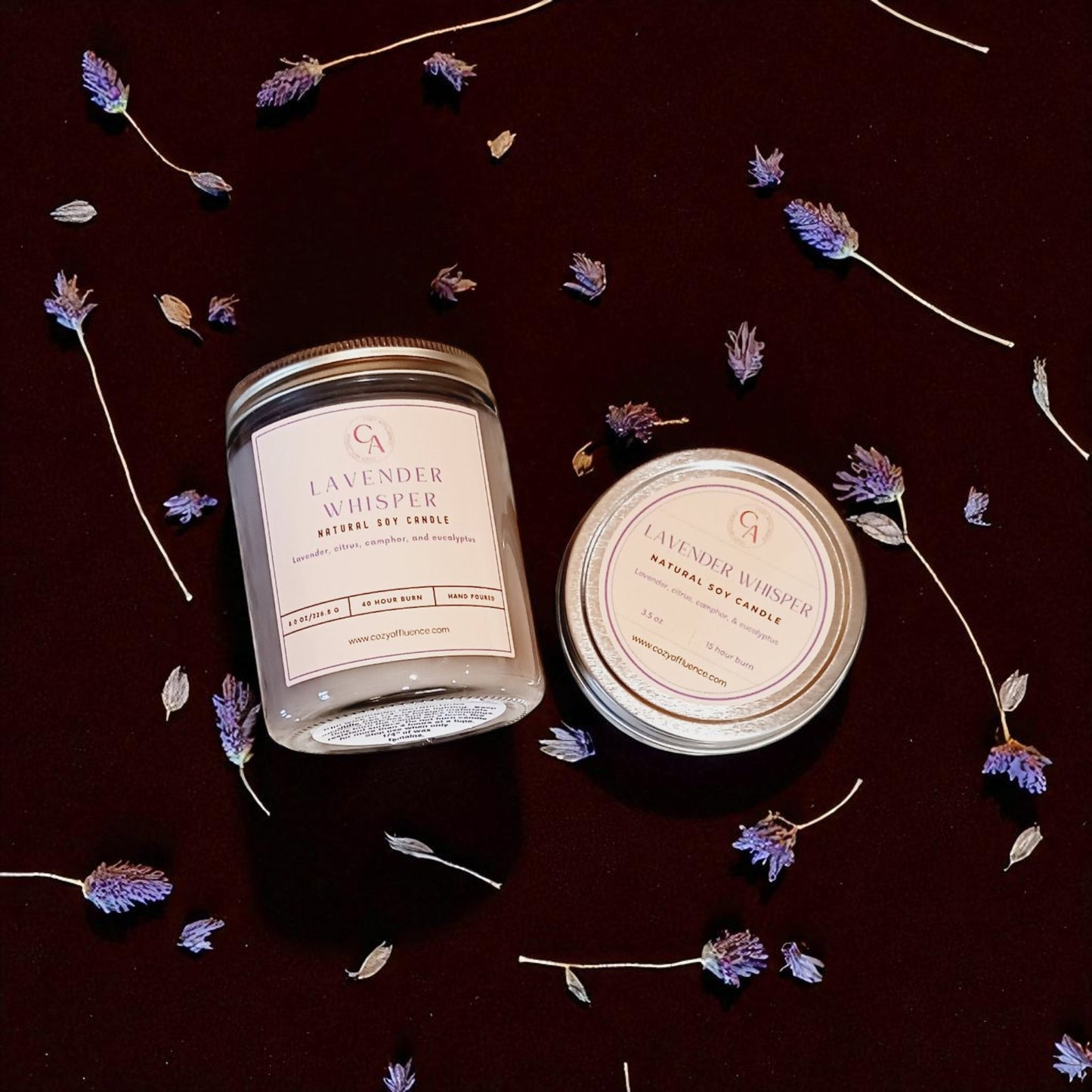 8oz & 3.5oz candles labeled 'Lavender Whisper' surrounded by lavender flowers on a dark surface.