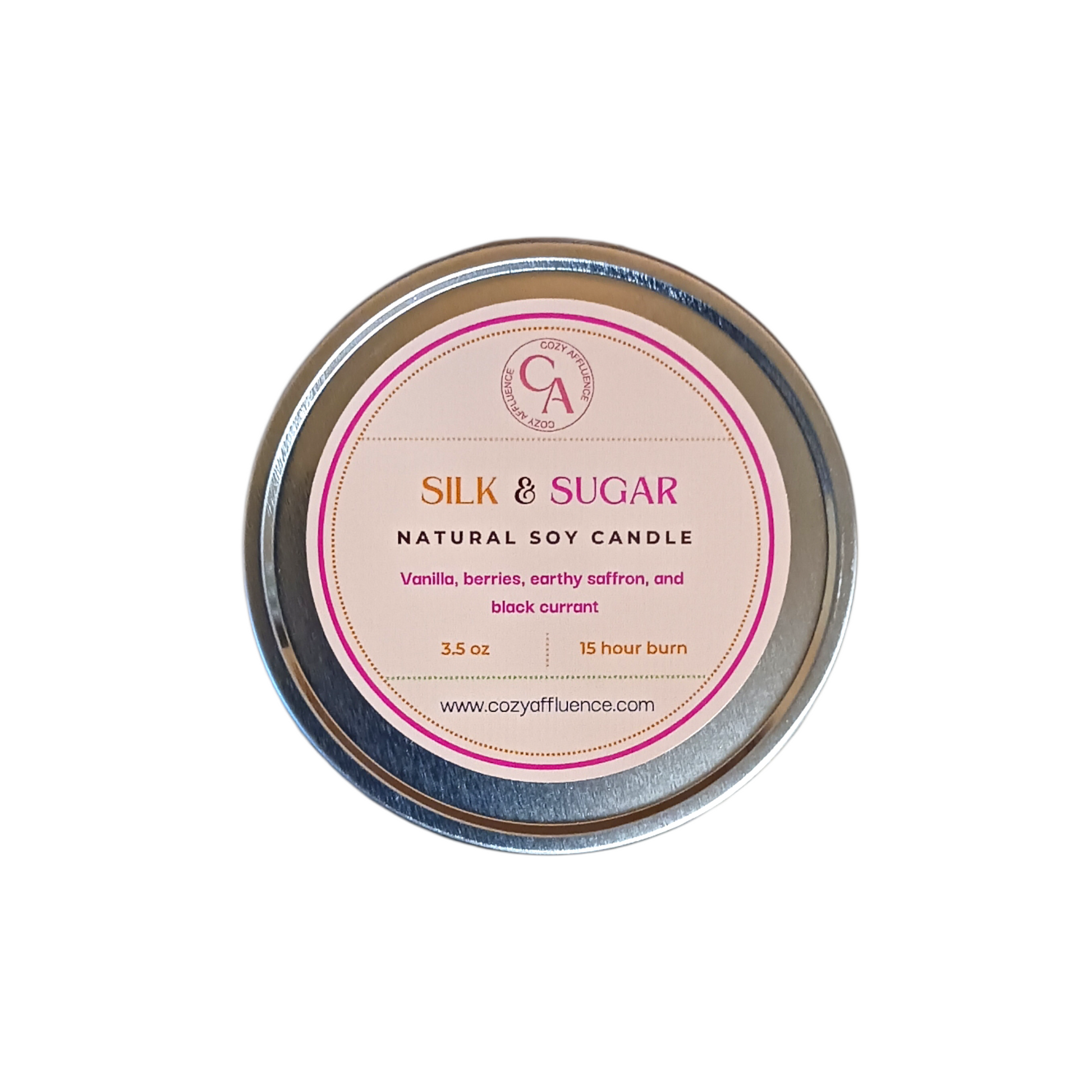 Silk & Sugar natural soy candle in a tin with a pink label on a white background
